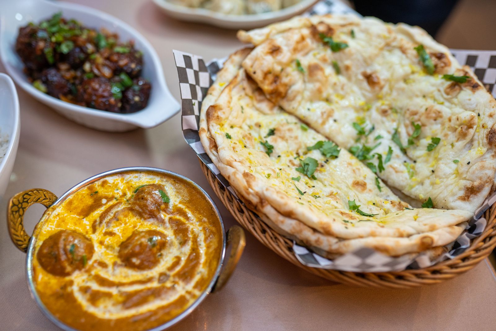 Fresh naan, roti and curry spread